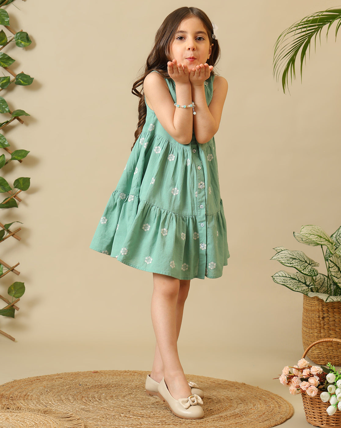 Mint green girls sleeveless A-line dress with floral embroidery and flared hem