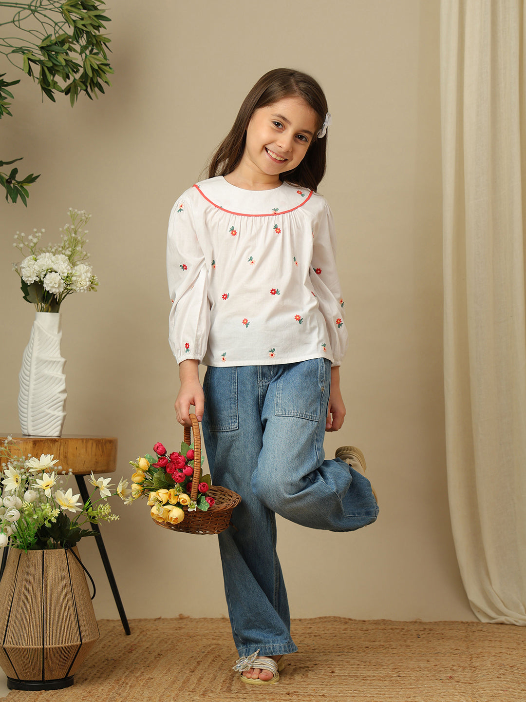 Girls white cotton shirt with red floral embroidery, green leaf detailing, collared neck, button-down front and full sleeves.