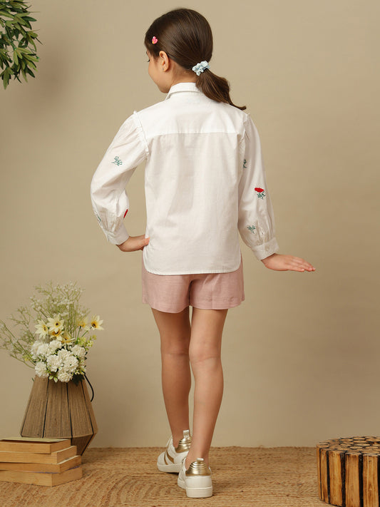 Girls white cotton shirt with red floral embroidery, green leaf detailing, collared neck, button-down front and full sleeves.