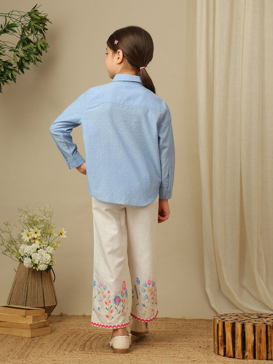 Girls blue cotton shirt with multicolour floral embroidery, classic collar, button-down front and full sleeves.