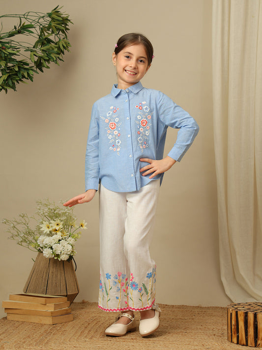 Girls blue cotton shirt with multicolour floral embroidery, classic collar, button-down front and full sleeves.