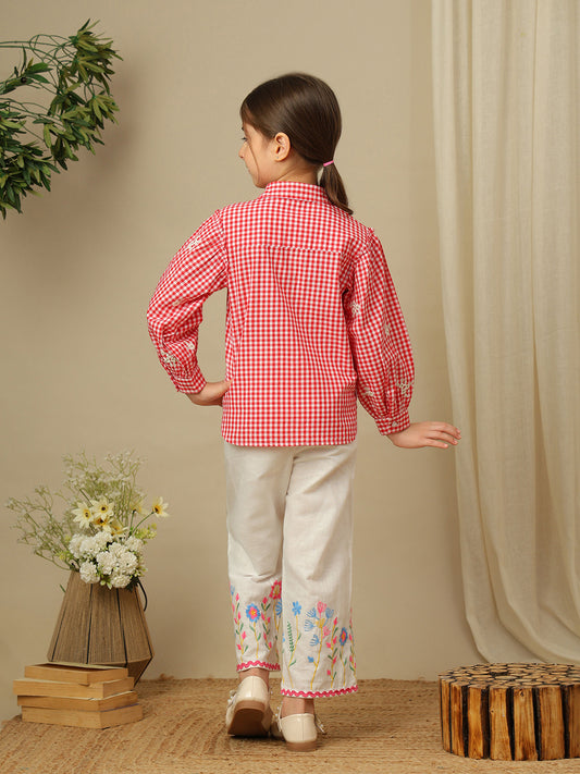 Girls red and white checked cotton shirt with floral embroidery, collared neck, button-down front and full puff sleeves.