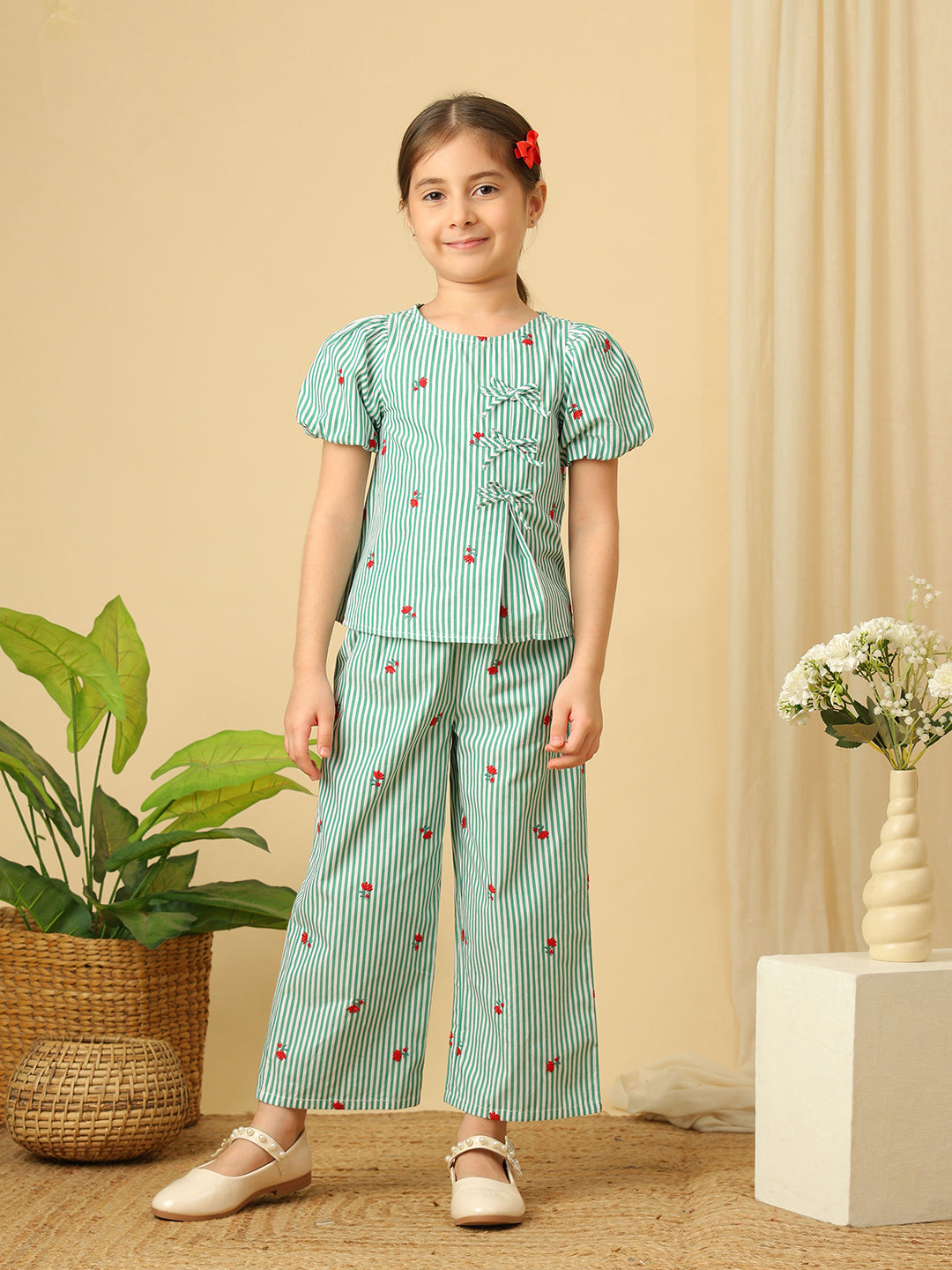 Girls green and white striped co-ord set with puff sleeves, bow details, floral embroidery and wide-leg pants