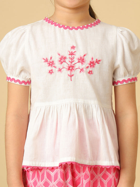 Girls pink and off-white floral embroidered co-ord set with puff sleeve peplum top and geometric print jogger pants