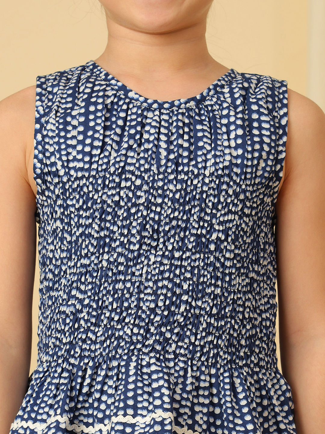 Girls navy blue printed smocked co-ord set with sleeveless peplum top and wide-leg ruffle pants